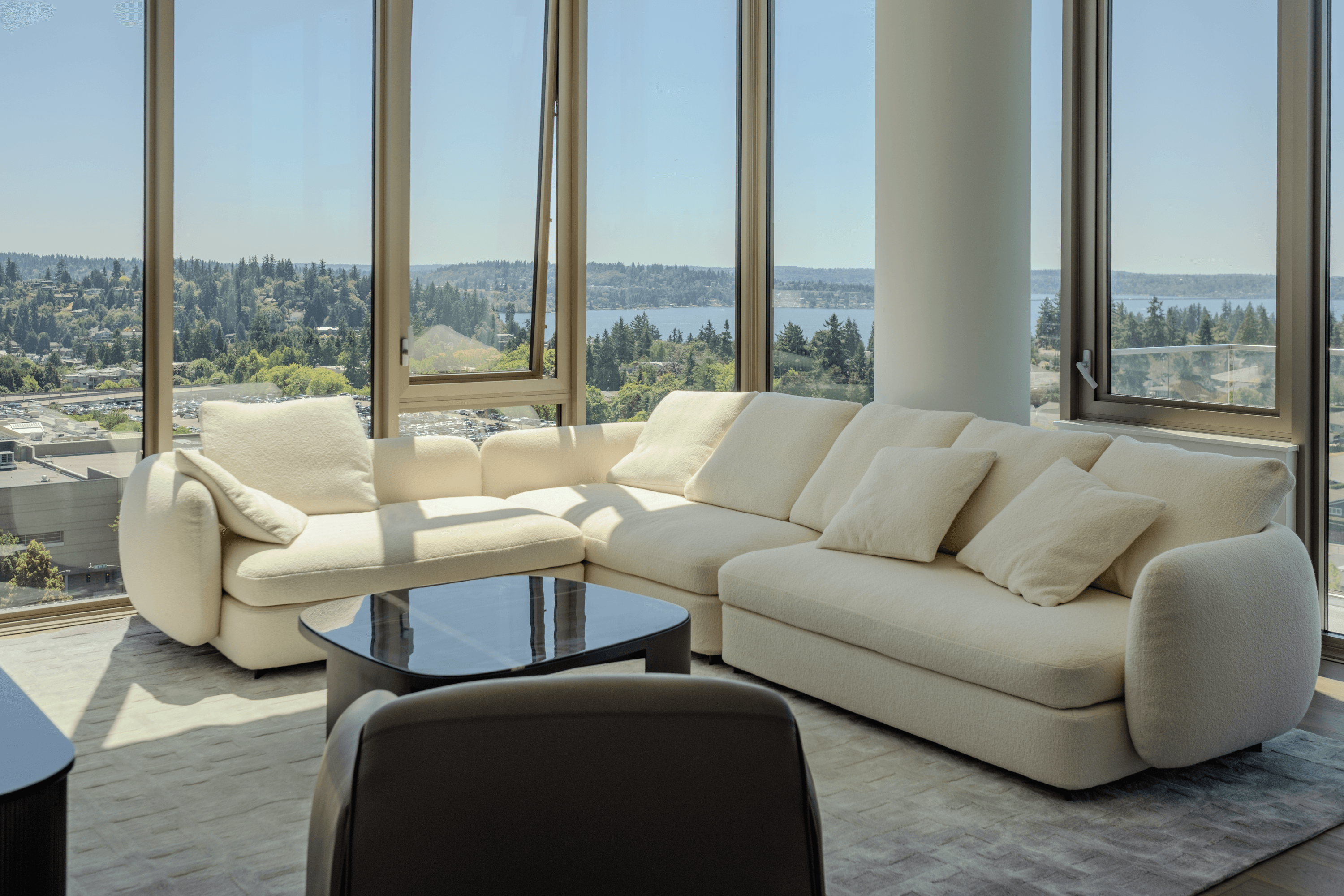 Sectional seating and a low table in a model residence at Mari Bellevue