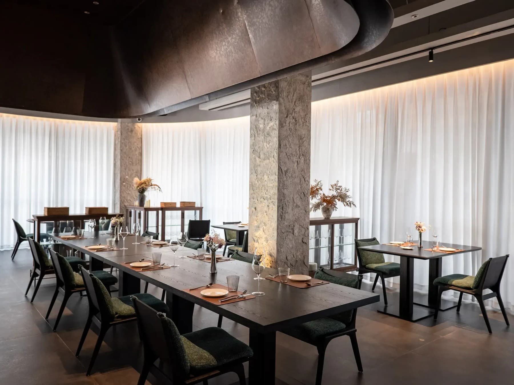 Cement-inspired dining interior at Sense Bistro
